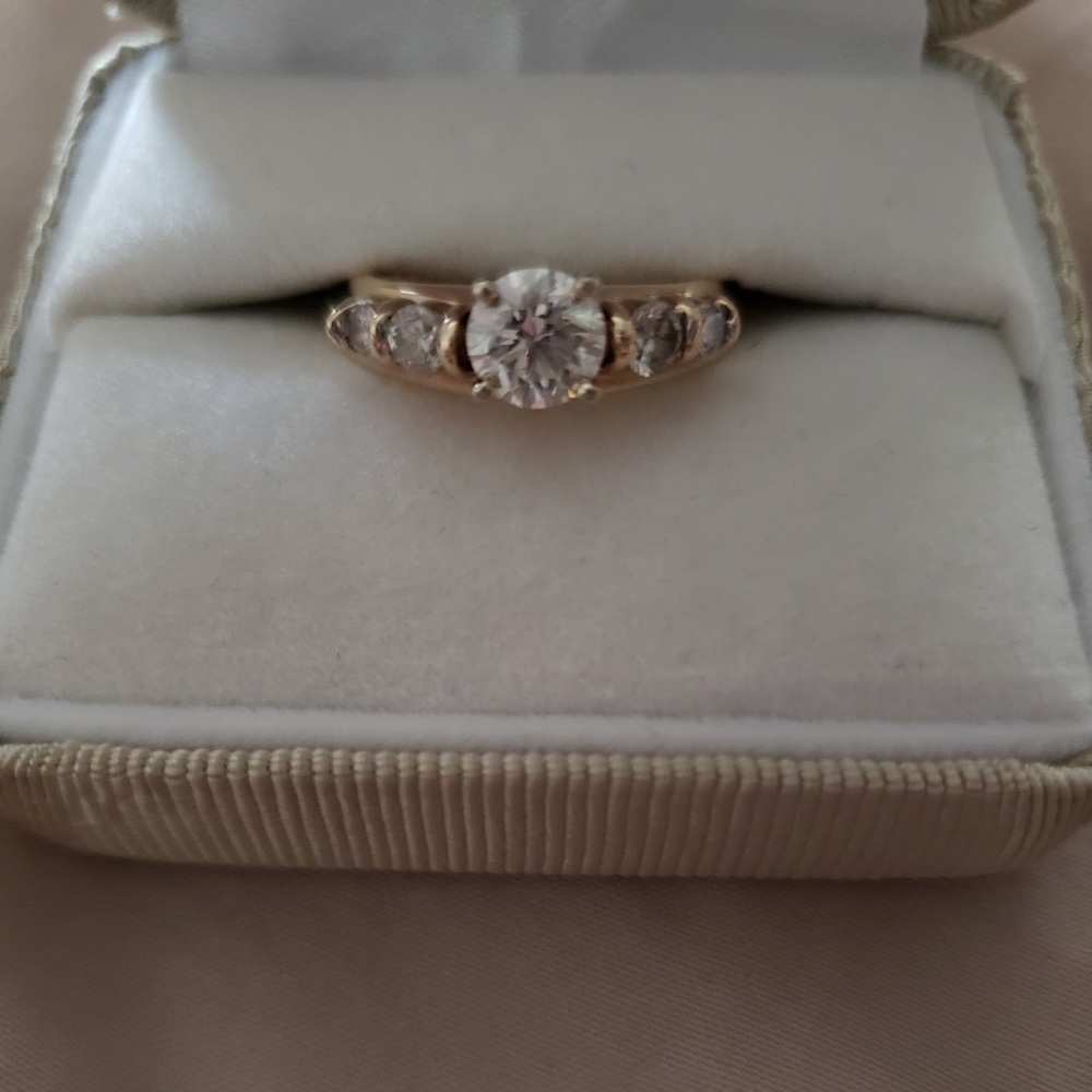 Diamond engagement ring with enhancer (soldered) and gold band.